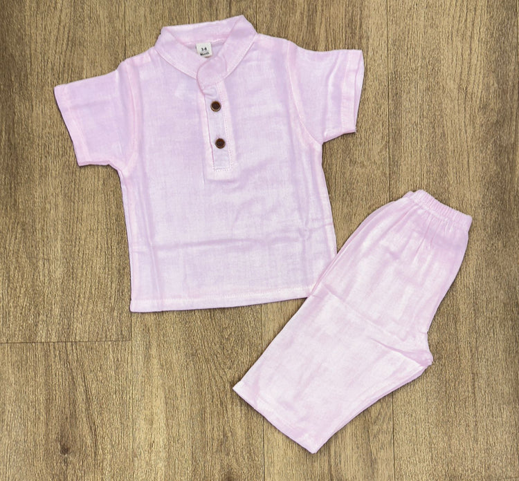 This image features is beige muslin co-ord set, consisting of a short-sleeve shirt and matching shorts.