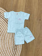 The item in the image is an (Magic train)Unisex Cotton Plain Baby Short Sleeves Suit & Short Pants. The small logo on both the shirt and shorts is a rainbow.
