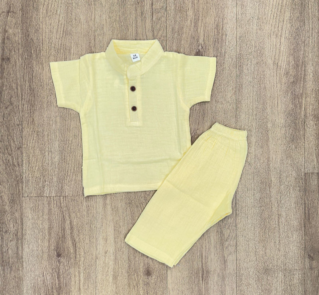 This image features is beige muslin co-ord set, consisting of a short-sleeve shirt and matching shorts.