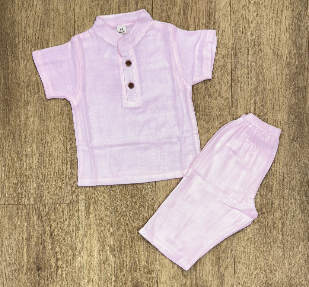 This image features is beige muslin co-ord set, consisting of a short-sleeve shirt and matching shorts.
