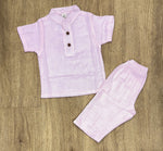 This image features is beige muslin co-ord set, consisting of a short-sleeve shirt and matching shorts.