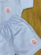 The item in the image is an (Magic train)Unisex Cotton Plain Baby Short Sleeves Suit & Short Pants. The small logo on both the shirt and shorts is a giraffe.