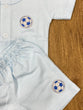 The item in the image is an (Magic train)Unisex Cotton Plain Baby Short Sleeves Suit & Short Pants. The small logo on both the shirt and shorts is a foot ball.